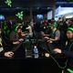 Consumer Electronic Show (CES) attendees gaming with Razer hardware in 2017.